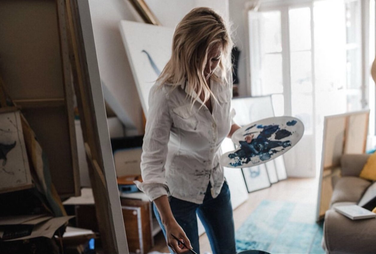 Jennifer Nicholson painting in her studio in Palma de Mallorca